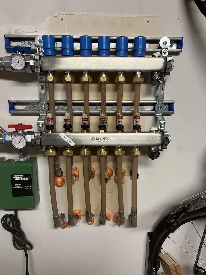 Plumber performing Water Heater Repair at a residential property in Baxter Springs